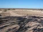 Transition from valleys and hills to open plain.